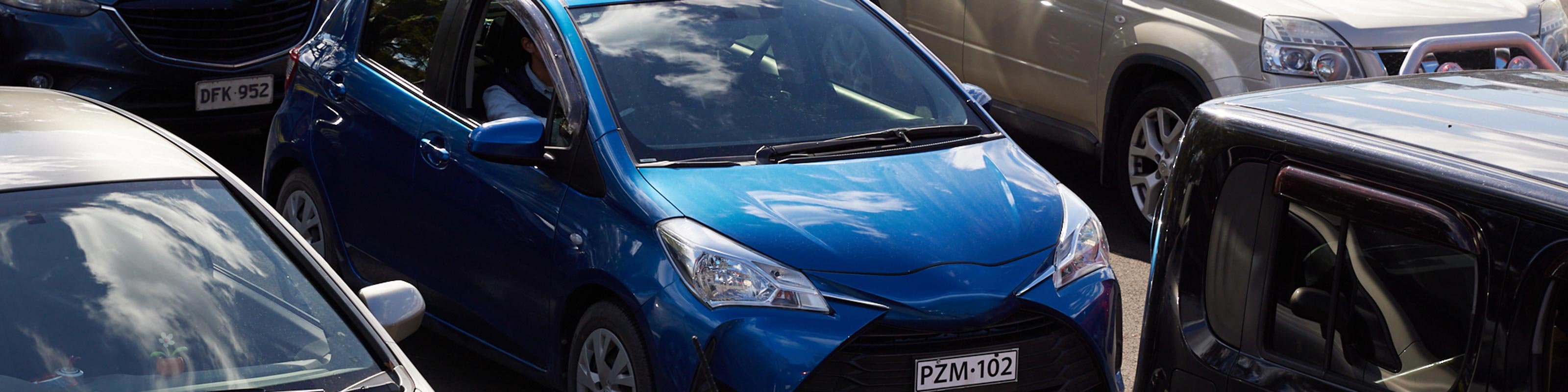 blue hatch stuck in bumper to bumper traffic