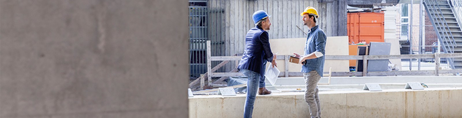 Two construction workers talking