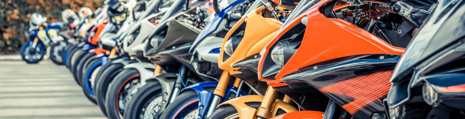 Row of colourful motorcycles on city street