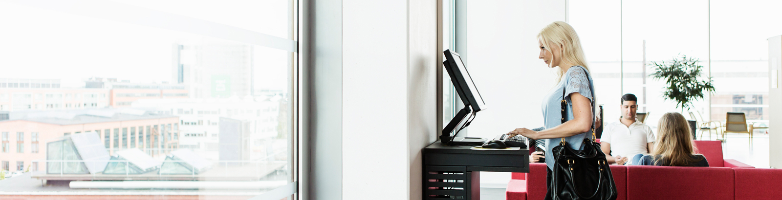 Woman using computer at office