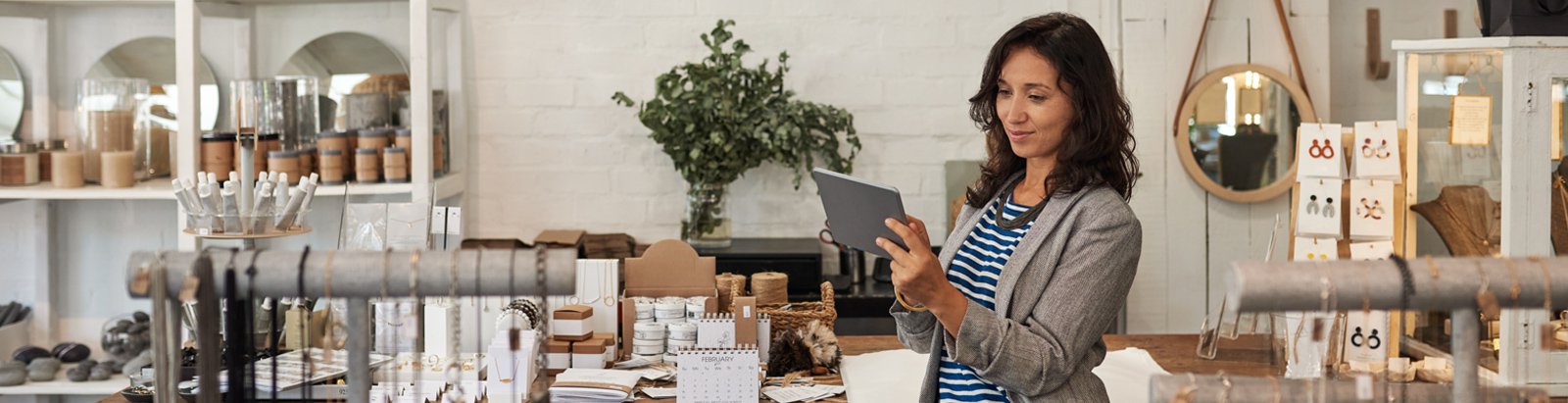 Woman holding ipad in retail store