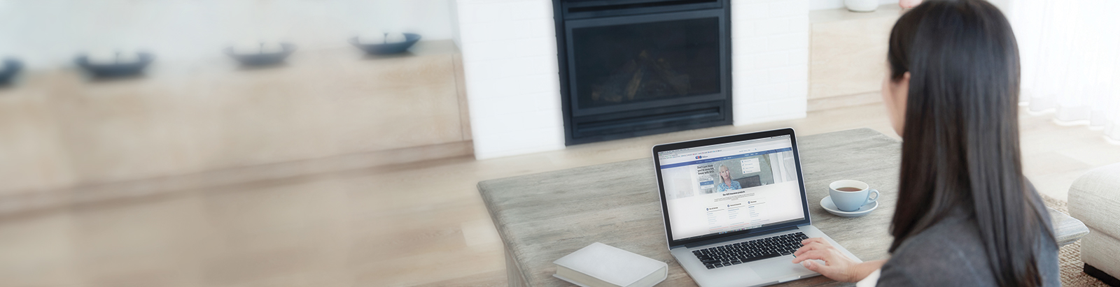 Woman with laptop in livingroom