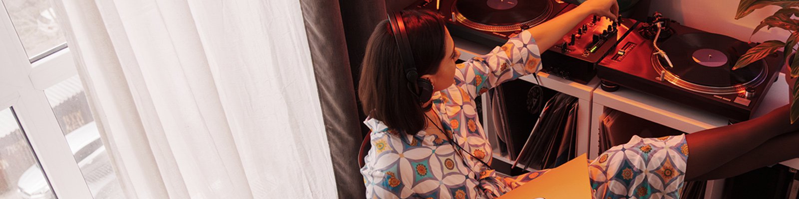 Woman listening to vinyl records