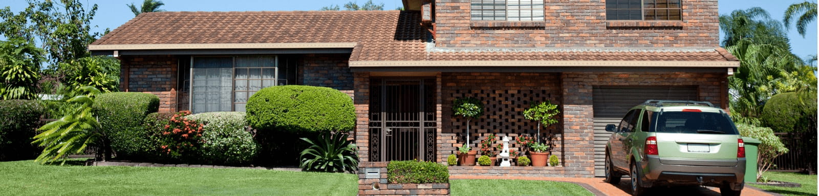 Brown brick double story suburban home