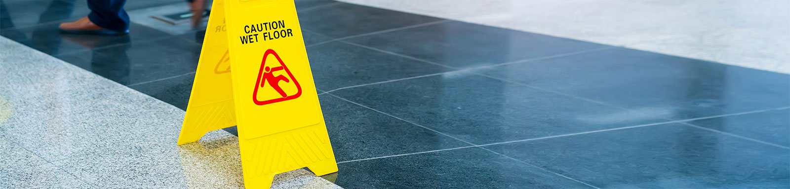 Wet floor caution sign on office floor