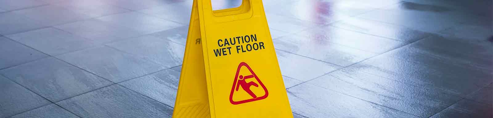 Wet floor caution sign on office floor