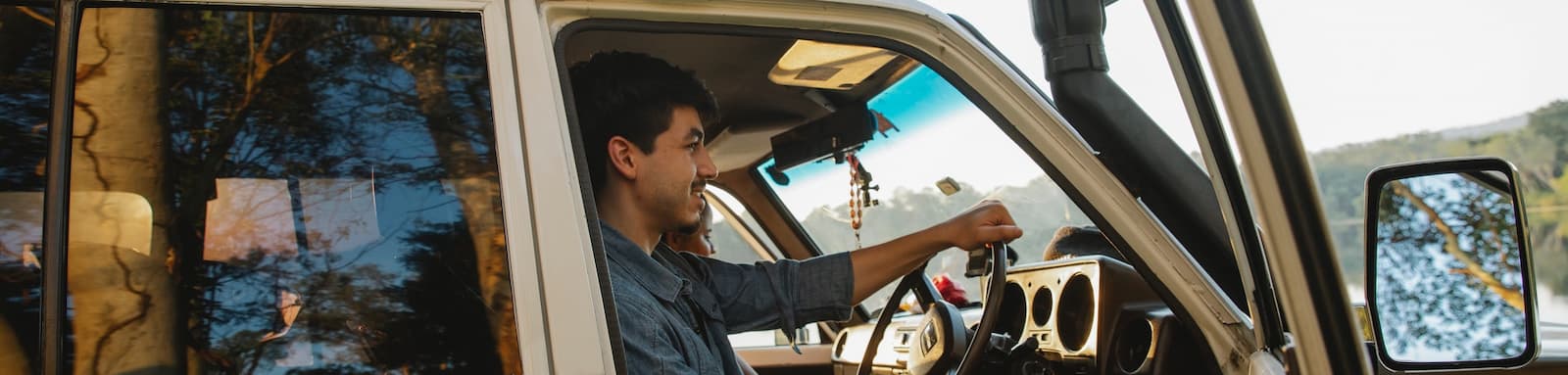 Man smiling while driving 4WD
