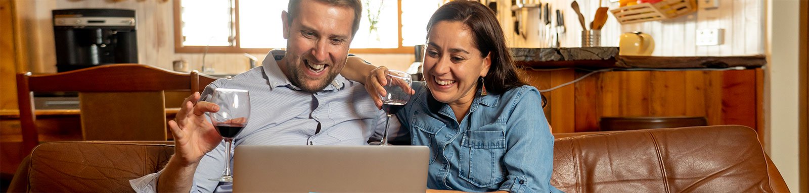 Couple using laptop at home