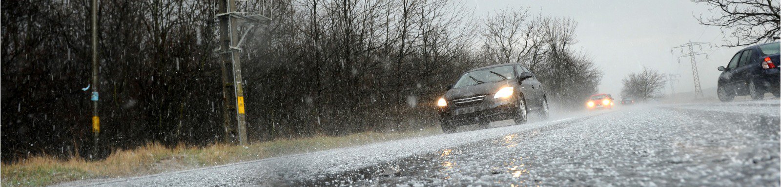 Car driving in a hailstorm 