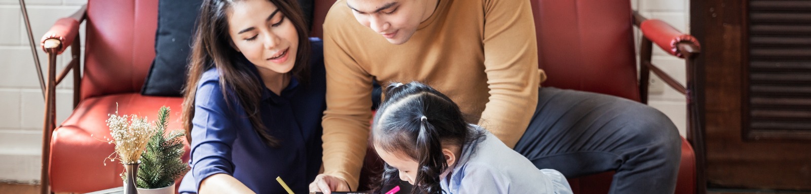 Family drawing at home with child 
