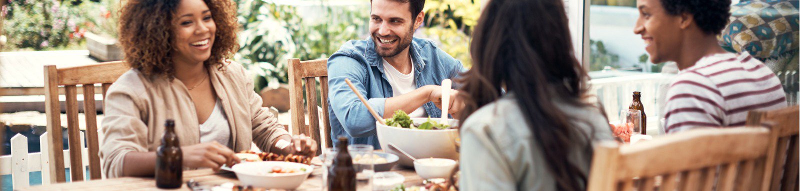 Group of friends having a meal outdoors