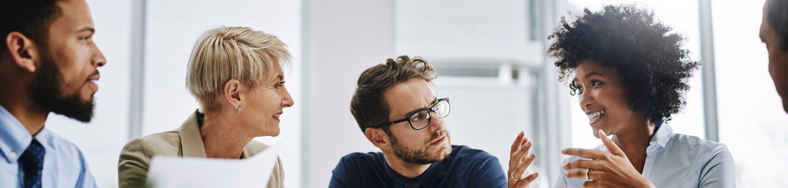 Group of people talking at office table