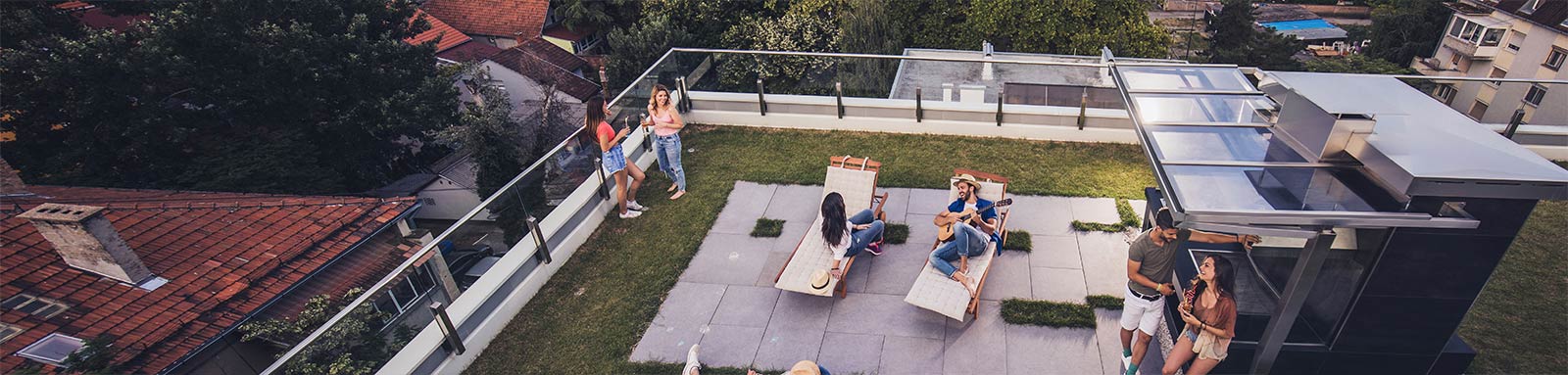 Group of young adult having good time on rooftop