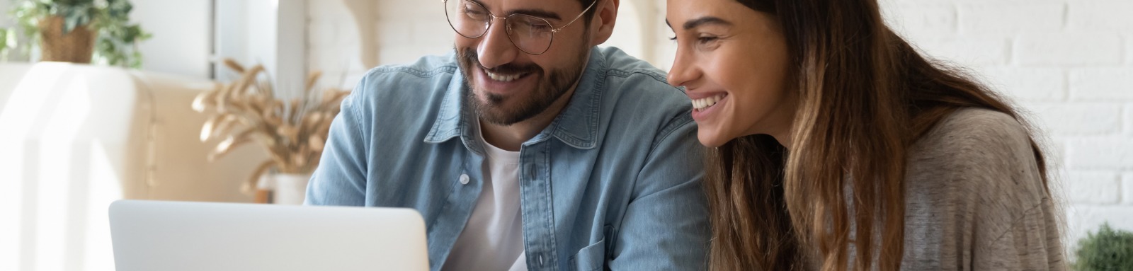 Man and woman looking at laptop computer