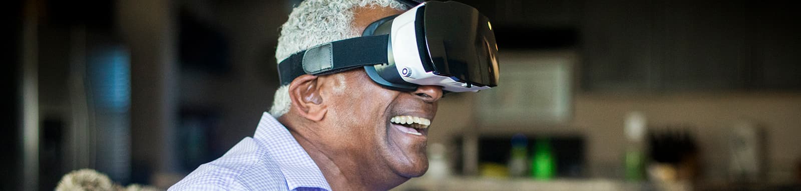 Smiling man with virtual reality glasses