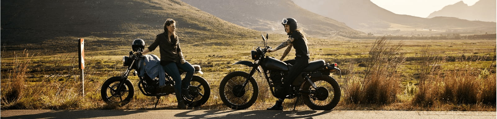Female motorcyclists on road trip