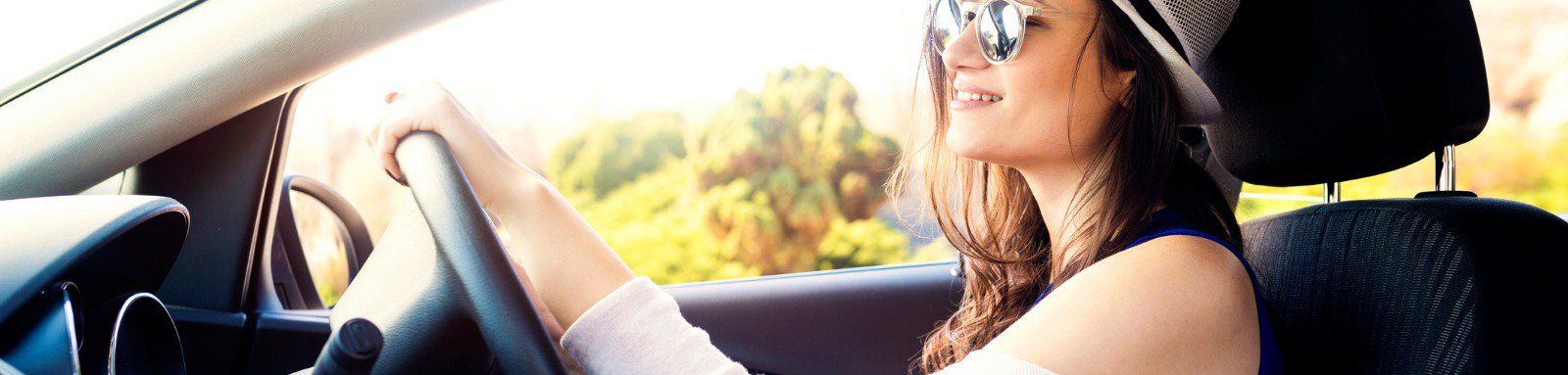 Woman with sunglasses driving