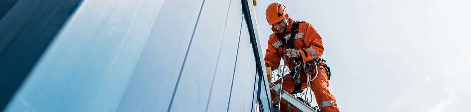 Workman in safety rig onsite