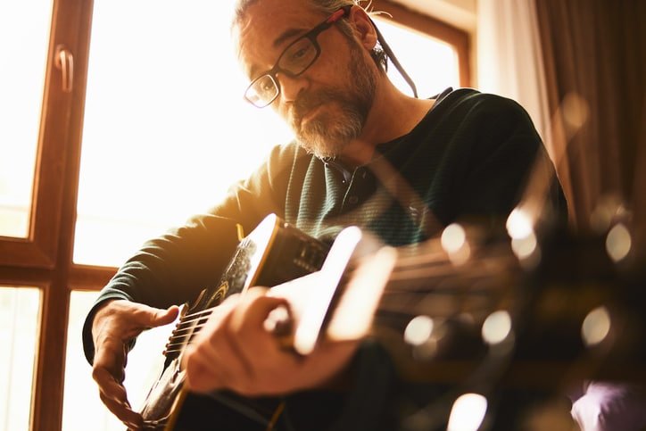 Man plays accoustic guitar