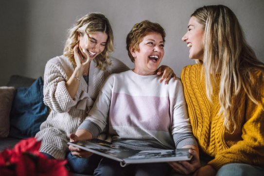 Mother enjoys photos with adult daughters