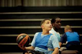 Man in wheelchair with basketball