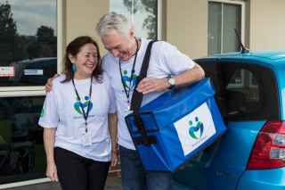 Meals on wheels volunteers head out on delivery